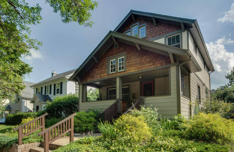 Residential addition by TDS Custom Construction added a new second floor, exterior makeover, primary bedroom with abundant closet space, an en suite bathroom, and guest room.