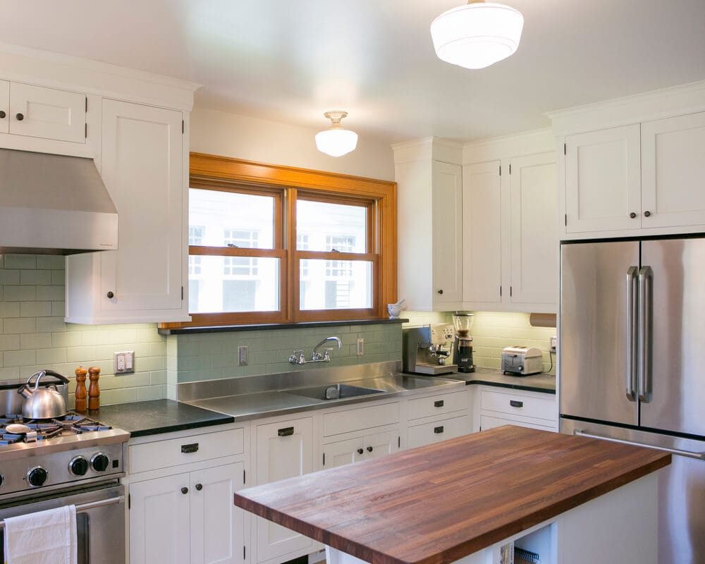 Kitchen remodel with custom Woodharbor inset cabinets, granite and Lyptus countertops by TDS Design Build in Madison, WI