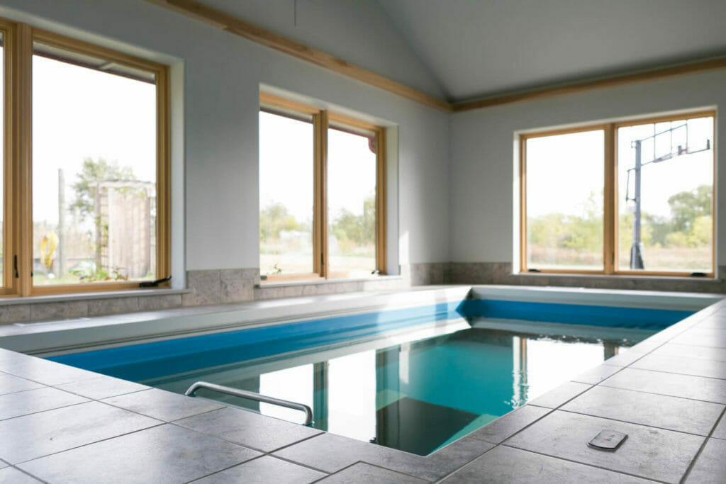 Pool addition with underwater treadmill in this new home designed for aging in place in Oregon, WI.