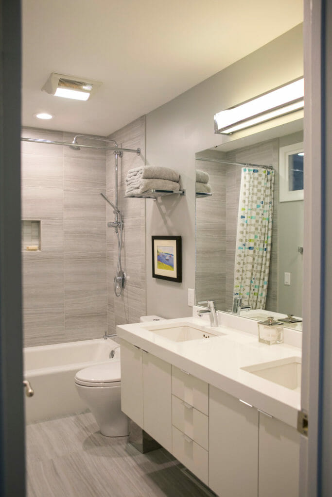 Custom kids bathroom remodel with quartz countertops and Woodharbor cabinets in Maple Bluff, Wisconsin by TDS Design Build.