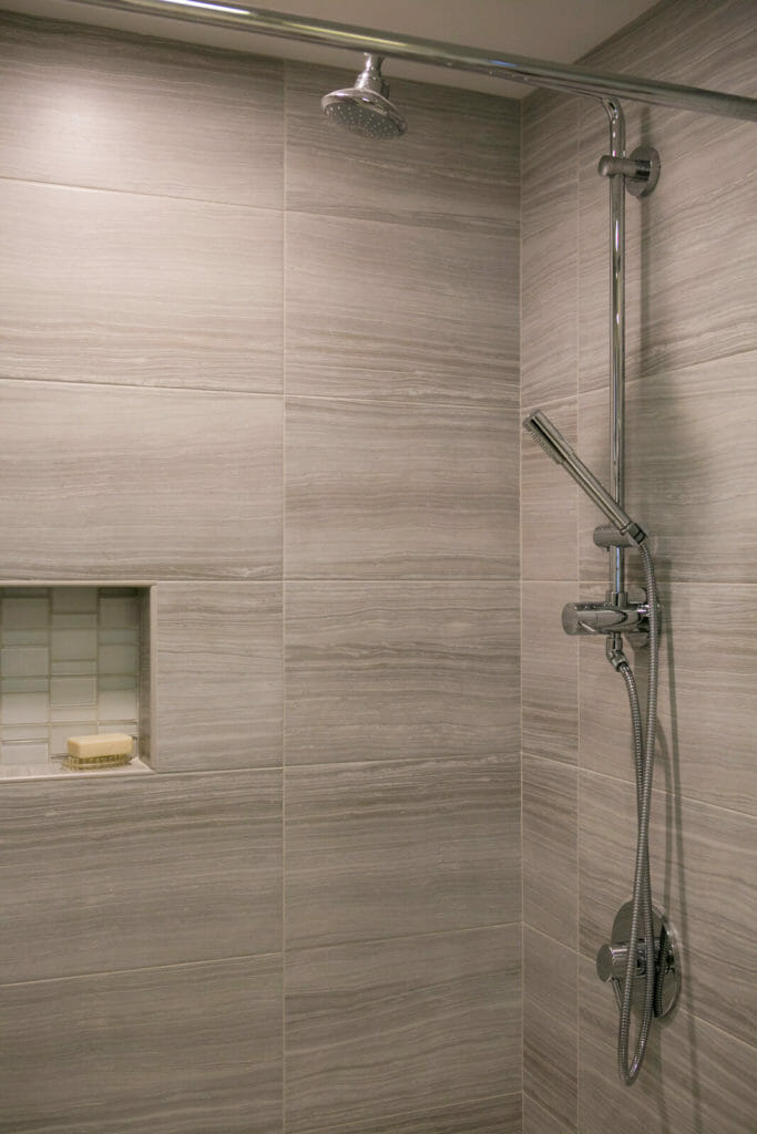 Custom kids bathroom remodel with tiled shower in Maple Bluff, Wisconsin by TDS Design Build.