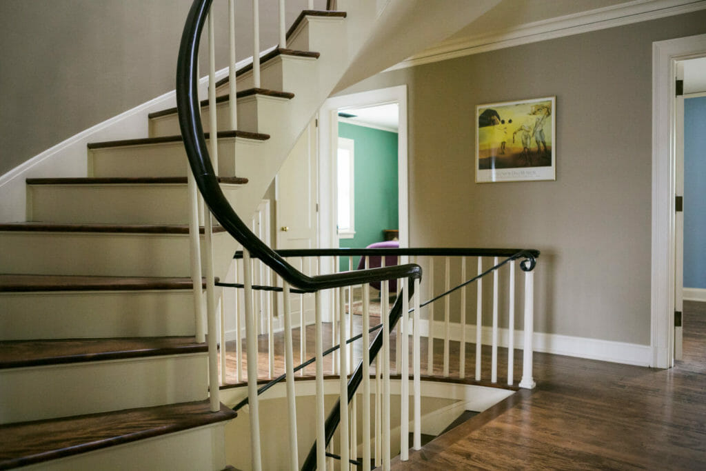 Refinished spiral staircase as part of the historic renovation of a 1922 Frank Riley Colonial Revival home in Madison, Wisconsin.