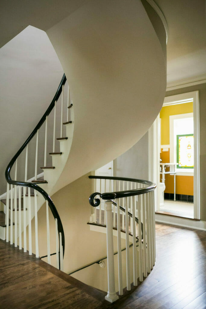 Refinished spiral staircase as part of the historic restoration of a 1922 Frank Riley Colonial Revival home in Madison, Wisconsin.