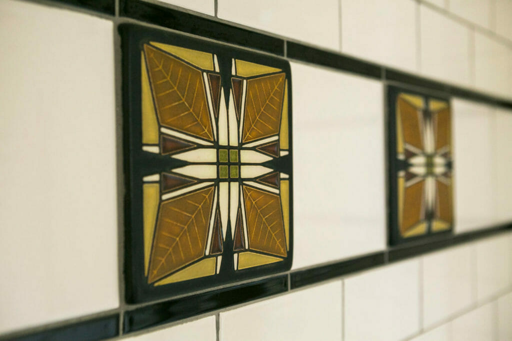 Motawi decorative bathroom shower tile in a historic renovation of a 1922 Frank Riley Colonial Revival home on the Isthmus in Madison, Wisconsin.