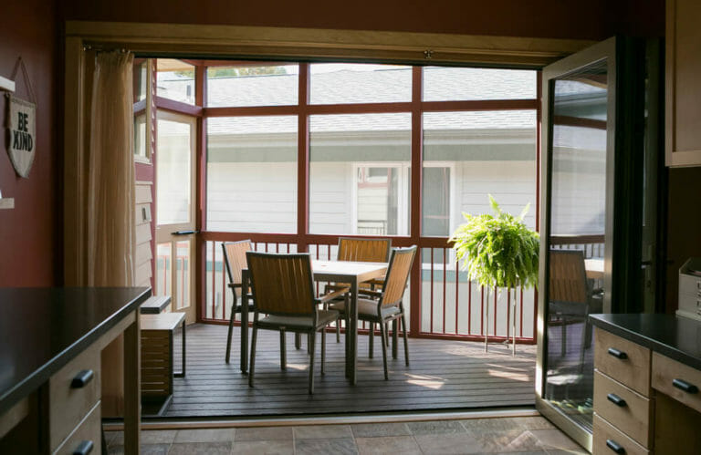 An addition of a screen porch with a full-length accordion door that opens up the family craft room in Middleton, WI by TDS Custom Construction.