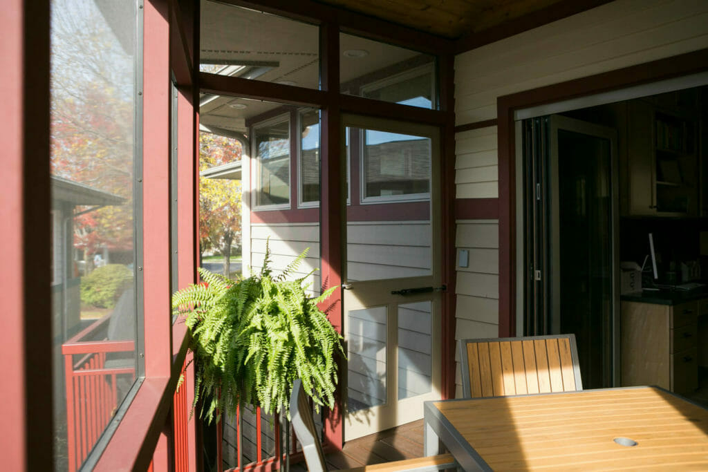 Screen porch and deck added to a new Middleton, Wisconsin home by TDS Design Build.