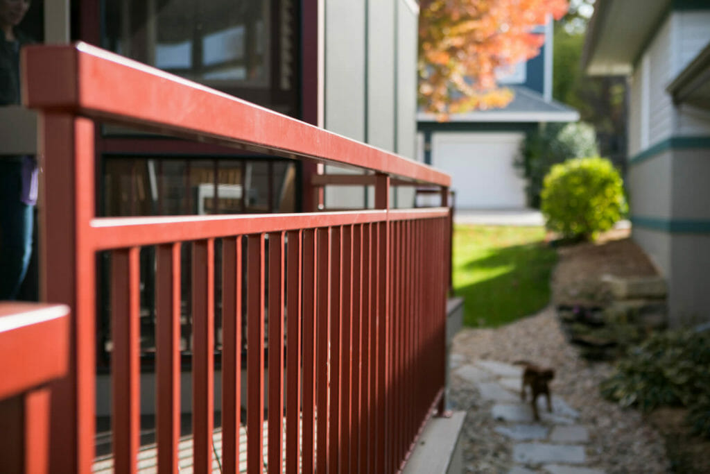 Screen porch and deck with railing added to a Middleton, Wisconsin home by TDS Design Build.