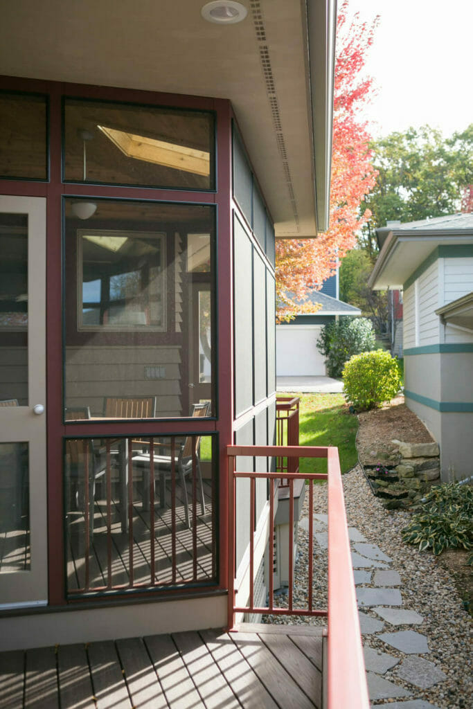 Screen porch and deck with railing added to a Middleton, Wisconsin home by TDS Design Build.