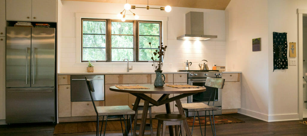 Lofted plywood ceilings, birch cabinets, stainless steel appliances and an open floor plan were part of the new kitchen in this whole house remodel in Monona, Wisconsin by TDS Custom Construction.