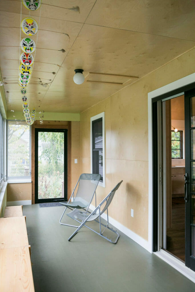 Plywood ceilings and walls were part of this modern entryway for a whole house remodel in Monona, Wisconsin by TDS Custom Construction.